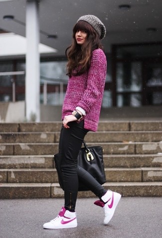 For an outfit that's super simple but can be styled in a variety of different ways, opt for a purple oversized sweater and black leather leggings. Now all you need is a pair of white leather high top sneakers to finish your outfit.