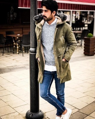 Olive Lightweight Parka Outfits For Men: This relaxed combo of an olive lightweight parka and navy jeans is very easy to throw together without a second thought, helping you look awesome and ready for anything without spending a ton of time searching through your wardrobe. White leather low top sneakers will be a welcome accompaniment for this look.