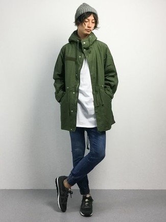 Dark Green Parka Outfits For Men: This off-duty pairing of a dark green parka and navy jeans is a foolproof option when you need to look dapper in a flash. To give your look a more laid-back touch, why not introduce a pair of black athletic shoes to this look?