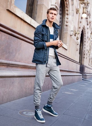 Navy Leather High Top Sneakers Outfits For Men: Combining a navy parka with grey sweatpants is an on-point choice for a laid-back look. When not sure as to the footwear, go with a pair of navy leather high top sneakers.