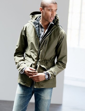 Dark Green Parka Outfits For Men: A dark green parka and blue jeans are an easy way to introduce extra cool into your casual rotation.