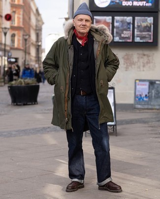 500+ Winter Outfits For Men: If you enjoy a more casual approach to menswear, why not opt for an olive parka and navy jeans? If you need to immediately up the ante of this getup with a pair of shoes, complement your look with a pair of dark brown leather desert boots. A practical example of practical style, this look must be in your front hall closet when cold weather comes.