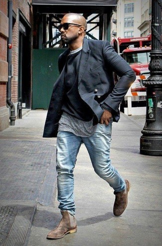 Kanye West wearing Black Pea Coat, Black Crew-neck Sweater, Grey Crew-neck T-shirt, Light Blue Jeans