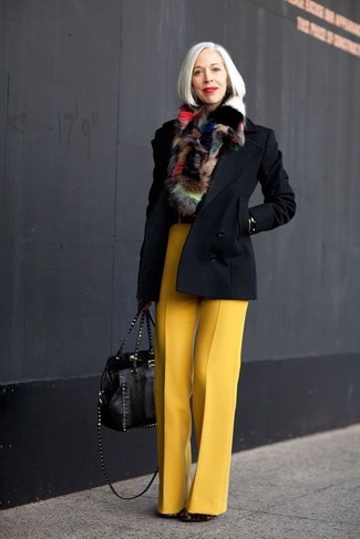 Linda Fargo wearing Black Pea Coat, Yellow Wool Wide Leg Pants, Black Suede Ankle Boots, Black Studded Leather Tote Bag