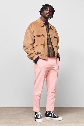 Men's Black and White Canvas High Top Sneakers, Pink Chinos, Multi colored Plaid Crew-neck Sweater, Tan Suede Shirt Jacket