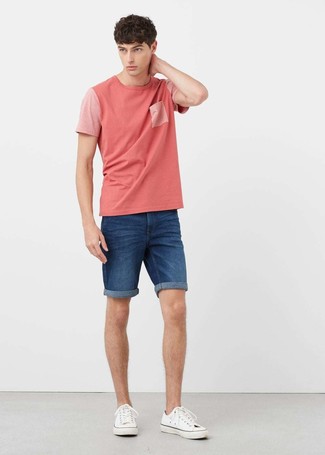 Hot Pink Crew-neck T-shirt Outfits For Men: This combination of a hot pink crew-neck t-shirt and blue denim shorts is proof that a straightforward off-duty getup doesn't have to be boring. White canvas low top sneakers tie the look together.