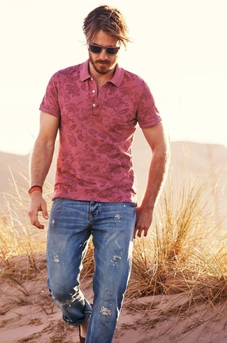 Pink Floral Polo Outfits For Men: You'll be surprised at how easy it is for any gent to pull together a contemporary outfit like this. Just a pink floral polo and blue ripped jeans. Let your sartorial expertise really shine by completing your look with dark brown suede espadrilles.