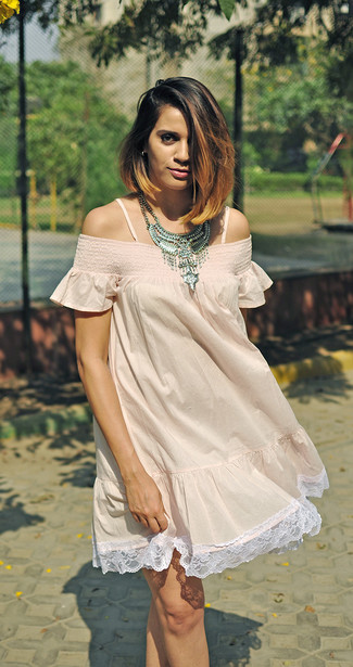 For the style that looks as cool as it can get, go for a pink lace off shoulder dress.