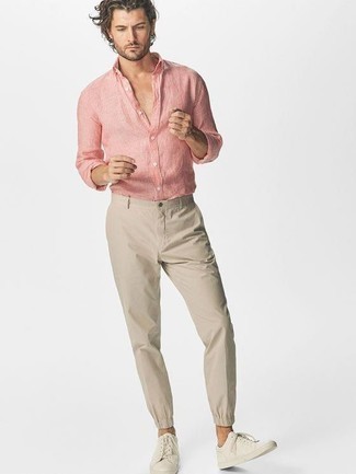 Pink Long Sleeve Shirt Outfits For Men: If you don't take fashion too seriously, go for a casual look in a pink long sleeve shirt and beige chinos. Beige leather low top sneakers are a fail-safe way to add an air of stylish nonchalance to your getup.