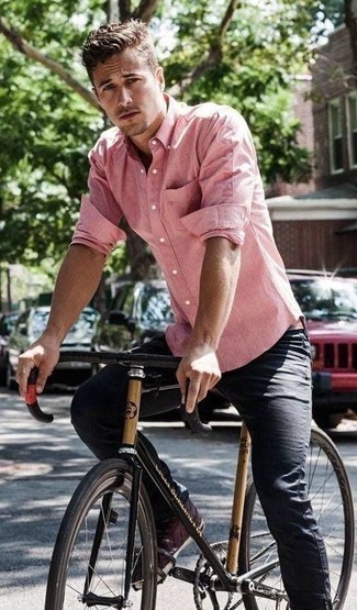 Pink Long Sleeve Shirt Outfits For Men: This off-duty combination of a pink long sleeve shirt and black jeans is ideal if you want to go about your day with confidence in your ensemble. Add burgundy leather low top sneakers to the equation and you're all set looking dashing.