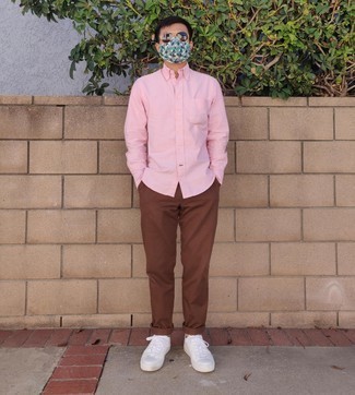 Men's Pink Long Sleeve Shirt, Brown Chinos, White Leather Low Top Sneakers, Dark Brown Sunglasses