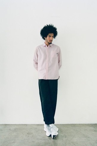 Pink Long Sleeve Shirt Outfits For Men: To assemble a laid-back ensemble with a modern take, wear a pink long sleeve shirt with navy chinos. Complete this outfit with a pair of white athletic shoes to give a dose of stylish nonchalance to this getup.