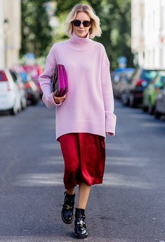 Black Leather Ankle Boots Outfits: A pink oversized sweater and a red midi skirt are absolute essentials that will integrate perfectly within your casual styling routine. Finishing off with black leather ankle boots is the most effective way to inject an added dose of refinement into this ensemble.