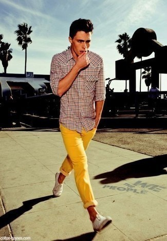Green-Yellow Jeans Outfits For Men: Dapper yet comfy, this ensemble is assembled from a pink plaid long sleeve shirt and green-yellow jeans. Finish off with a pair of white canvas low top sneakers and the whole ensemble will come together perfectly.