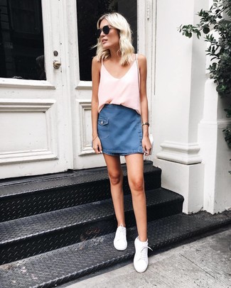 Navy Denim Mini Skirt Outfits: This casual combination of a pink silk tank and a navy denim mini skirt can take on different forms according to the way you style it. On the shoe front, this look pairs brilliantly with white low top sneakers.