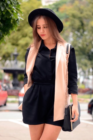 Sleeveless Blazer Outfits: A sleeveless blazer and a black shift dress work together smoothly.