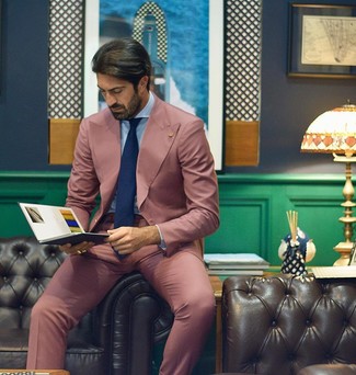 Pink Suit Outfits: We love how this pairing of a pink suit and a light blue dress shirt instantly makes any man look dapper and elegant.