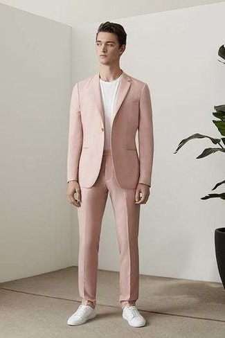 Hot Pink Suit Outfits: This combo of a hot pink suit and a white crew-neck t-shirt is a surefire option when you need to look dapper but have zero time to pull together a look. Unimpressed with this outfit? Let white canvas low top sneakers change things up a bit.