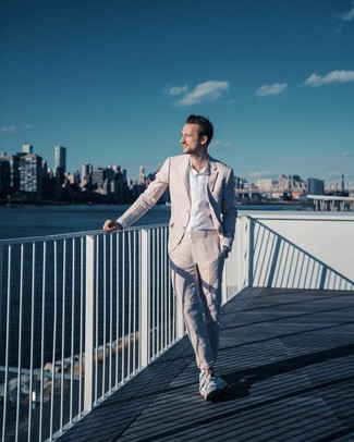 White Linen Long Sleeve Shirt Outfits For Men: Loving how this combination of a white linen long sleeve shirt and a pink suit instantly makes any man look smart and polished. For something more on the casual side to finish this look, add white low top sneakers to the equation.
