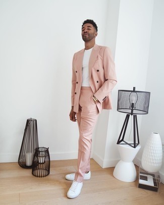 Pink Suit Outfits: This combination of a pink suit and a white long sleeve t-shirt looks neat and immediately makes any gentleman look on-trend. White canvas low top sneakers are an effortless way to transform this ensemble.