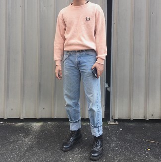 Pink Sweatshirt Outfits For Men: This pairing of a pink sweatshirt and light blue jeans is on the off-duty side yet it's also sharp and seriously stylish. Complement this ensemble with black leather casual boots to instantly change up the ensemble.
