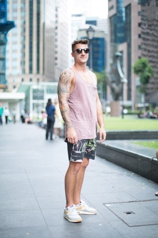 Pink Tank Outfits For Men: Opt for a pink tank and charcoal print shorts to create a laid-back and absolutely dapper outfit. A pair of white athletic shoes looks perfect rounding off this ensemble.