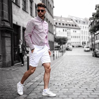 Pink Long Sleeve Shirt Outfits For Men: Rock a pink long sleeve shirt with white shorts for an everyday look that's full of charm and personality. Complement your outfit with a pair of white leather low top sneakers and the whole outfit will come together brilliantly.