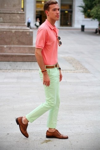 Pink Polo Outfits For Men: A pink polo and mint chinos are a good combination worth integrating into your daily casual routine. Brown leather brogues are a guaranteed way to inject a dose of class into this ensemble.