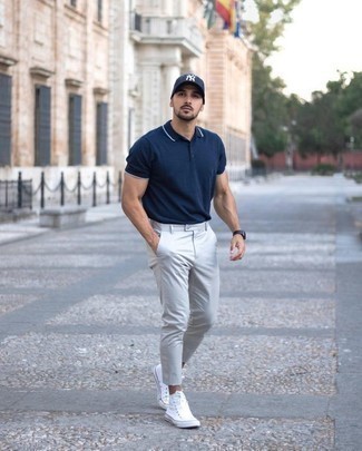 Navy Print Baseball Cap Outfits For Men: This combination of a navy polo and a navy print baseball cap embodies laid-back attitude and stylish practicality. And if you wish to immediately up this ensemble with a pair of shoes, complete your look with a pair of white canvas high top sneakers.
