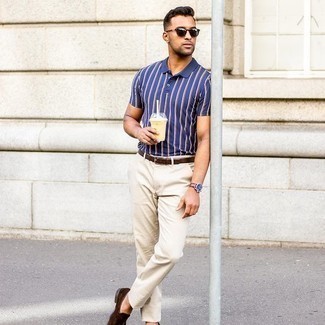 Dark Brown Leather Belt Hot Weather Outfits For Men: This pairing of a navy vertical striped polo and a dark brown leather belt will prove your expertise in menswear styling even on dress-down days. Feeling inventive? Spice things up by finishing off with dark brown suede loafers.