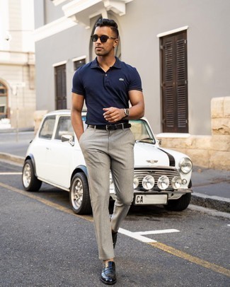Navy Polo Outfits For Men: Choose a navy polo and grey chinos if you seek to look casually dapper without spending too much time. To add a little fanciness to this outfit, add a pair of black leather loafers to the equation.
