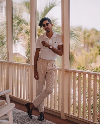 Beige Vertical Striped Chinos Outfits: Try pairing a white polo with beige vertical striped chinos to put together an interesting and current casual ensemble. Breathe an extra touch of style into your look by wearing a pair of dark brown leather loafers.