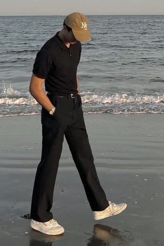 Black Polo Outfits For Men: This pairing of a black polo and black chinos is hard proof that a pared down off-duty look can still look really interesting. Complement this ensemble with a pair of white canvas low top sneakers and the whole ensemble will come together.