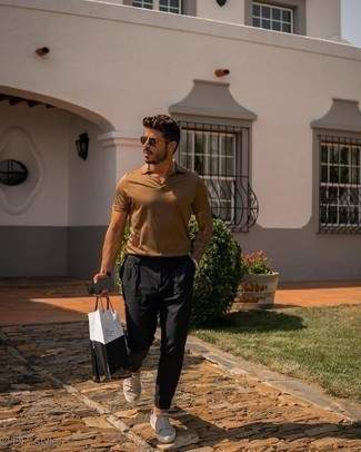 Black Vertical Striped Chinos Outfits: For a foolproof off-duty option, you can always rely on this combo of a brown polo and black vertical striped chinos. Let your styling skills truly shine by finishing off your outfit with beige canvas low top sneakers.