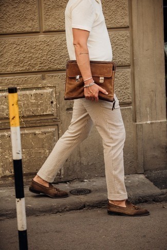 White and Navy Vertical Striped Chinos Outfits: Rock a white polo with white and navy vertical striped chinos if you want to look casually dapper without trying too hard. Bump up the appeal of this look by rounding off with dark brown suede tassel loafers.