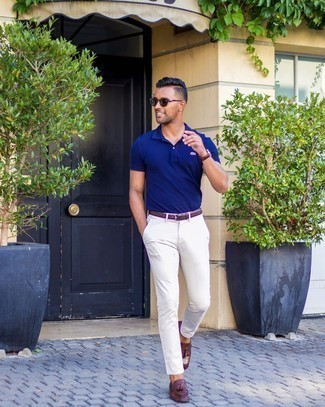 White Chinos Outfits: For a casual look, team a navy polo with white chinos — these two items go nicely together. Amp up this whole getup by finishing with dark brown leather tassel loafers.