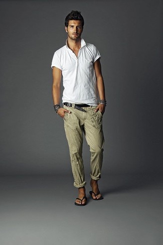 Flip Flops Outfits For Men: A white polo and olive linen dress pants: here it is, you've found the outfit of your dreams. Take your getup a more laid-back path by rocking flip flops.