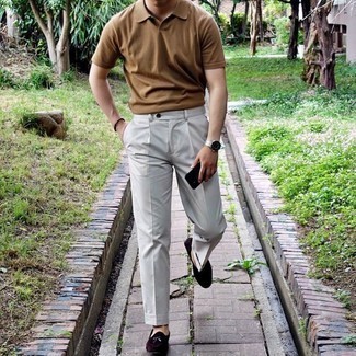 Tan Polo Outfits For Men: This smart combination of a tan polo and grey dress pants is very easy to throw together without a second thought, helping you look awesome and ready for anything without spending a ton of time digging through your wardrobe. A pair of dark brown suede loafers will introduce a classy aesthetic to the outfit.