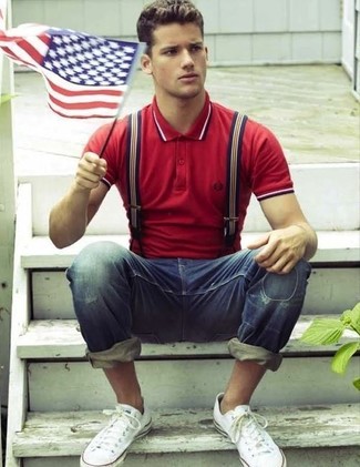 Men's Red Polo, Blue Ripped Jeans, White Low Top Sneakers, White and Red and Navy Vertical Striped Suspenders