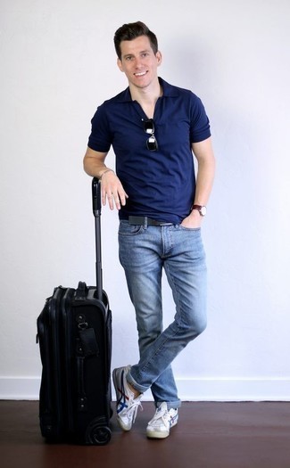 Men's Navy Polo, Light Blue Jeans, White and Blue Canvas Low Top Sneakers, Black Suitcase
