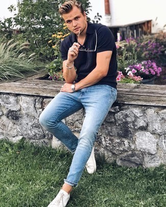 Aquamarine Jeans Outfits For Men: Consider teaming a navy polo with aquamarine jeans for a sharp, laid-back ensemble. When in doubt as to what to wear on the footwear front, add white canvas low top sneakers to the equation.