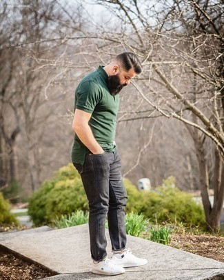 Dark Green Polo Outfits For Men: This is solid proof that a dark green polo and charcoal jeans are amazing when worn together in a casual look. If not sure as to what to wear on the shoe front, go with a pair of white leather low top sneakers.