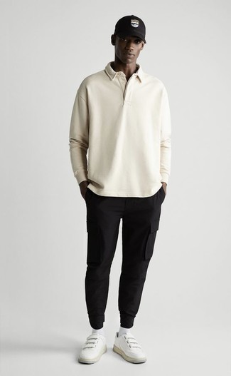 Black Cargo Pants Outfits: If the dress code calls for an effortlessly smart look, wear a beige polo neck sweater and black cargo pants. When it comes to shoes, go for something on the casual end of the spectrum with a pair of white leather low top sneakers.