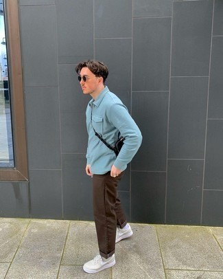 Light Blue Polo Neck Sweater Outfits For Men: For an effortlessly classic menswear style, make a light blue polo neck sweater and dark brown chinos your outfit choice — these pieces work beautifully together. Introduce a playful vibe to with beige leather low top sneakers.