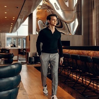 Navy Polo Neck Sweater Outfits For Men: Channel your inner fashionisto and consider teaming a navy polo neck sweater with grey chinos. Introduce a more casual touch to by finishing off with a pair of white and black leather low top sneakers.