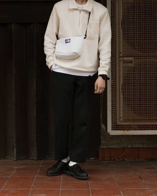 White Canvas Messenger Bag Outfits: This laid-back pairing of a beige polo neck sweater and a white canvas messenger bag comes to rescue when you need to look stylish but have zero time to dress up. To add more class to your getup, finish off with a pair of black leather desert boots.
