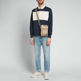 Men's Navy and White Polo Neck Sweater, Light Blue Jeans, White Canvas Low Top Sneakers, Beige Canvas Messenger Bag