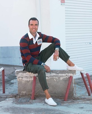 White Canvas Slip-on Sneakers Outfits For Men: This combination of a multi colored horizontal striped polo neck sweater and dark green cargo pants is hard proof that a pared down casual outfit doesn't have to be boring. The whole getup comes together when you complete this look with a pair of white canvas slip-on sneakers.