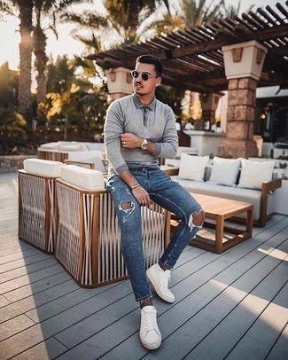 Grey Polo Neck Sweater Outfits For Men: For a look that's pared-down but can be worn in a myriad of different ways, reach for a grey polo neck sweater and blue ripped skinny jeans. Throw a pair of white canvas low top sneakers in the mix and ta-da: this ensemble is complete.