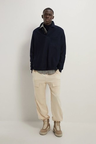 Navy Polo Neck Sweater Outfits For Men: A navy polo neck sweater and beige cargo pants paired together are a perfect match. You can take a more relaxed approach with shoes and complete your outfit with brown canvas work boots.